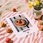 Pretzel (Brezen) – on Striped Tablecloth, German Pastry Wall Decor, unframed on coastal sand