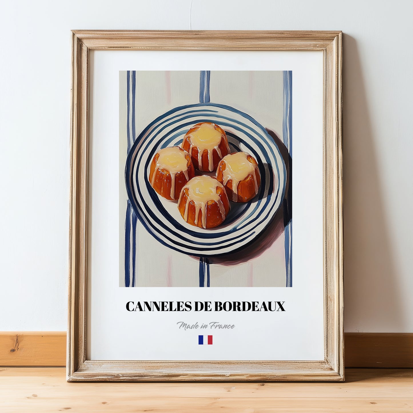 Canelés de Bordeaux – on Striped Tablecloth, French French Pastry Still Life, in wooden frame leaning on the floor