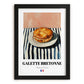 Galette Bretonne – on Striped Tablecloth, French Pastry Print, in sleek black frame