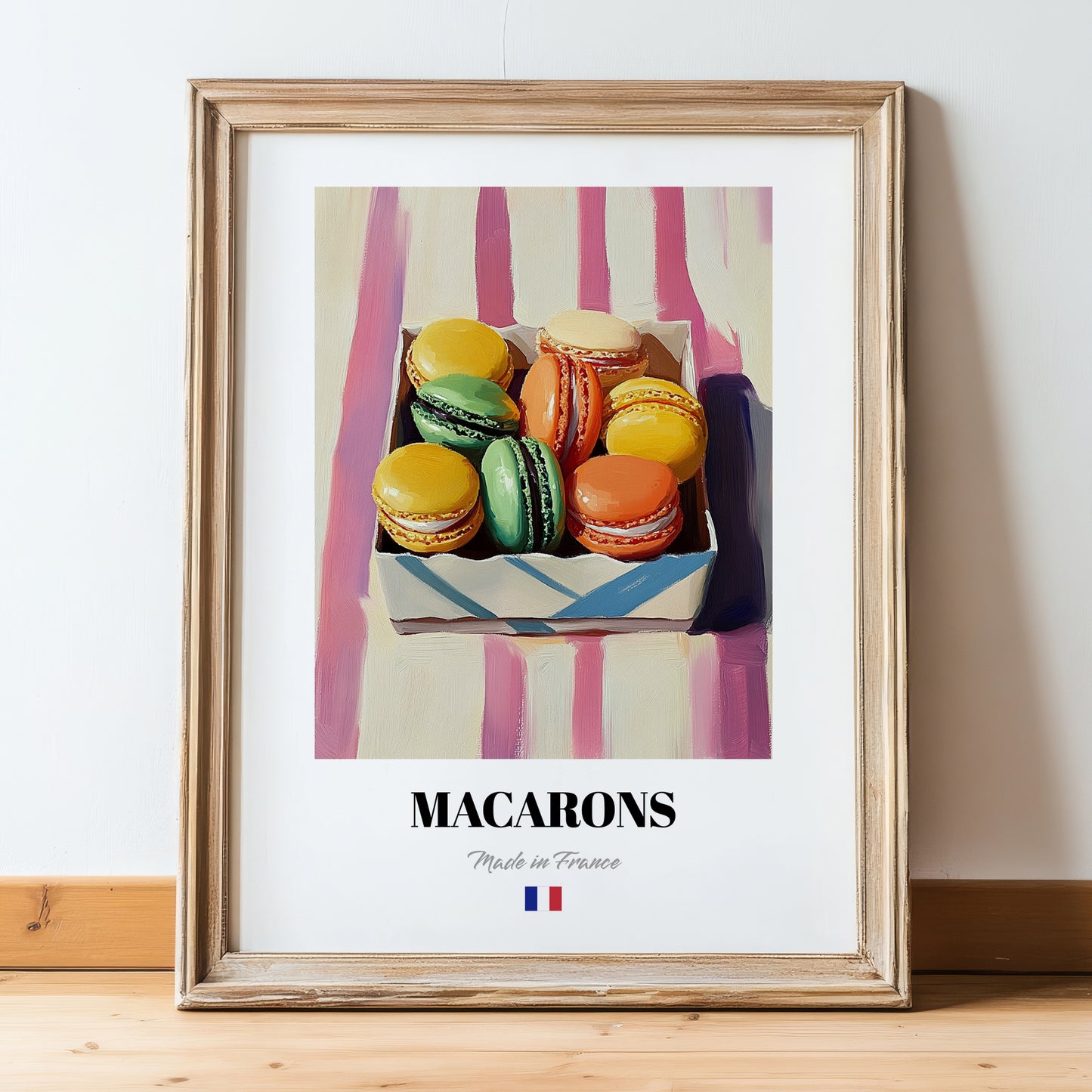 Macarons – on Striped Tablecloth, French French Dessert Still Life, in wooden frame leaning on the floor