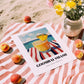 Goombay Smash – Bahamian Coastal Café Moment, Bahamian Cocktail Print, unframed on coastal sand