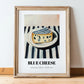 Blue – on Striped Tablecloth, Cheese Poster, in wooden frame leaning on the floor