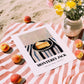 Monterey Jack – on Striped Tablecloth, Cheese Wall Art, unframed on coastal sand
