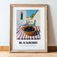 Blackberry – White village Street Café Scene, Berries Print, in wooden frame leaning on the floor