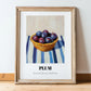 Plum – on Striped Tablecloth, Fruit Print, in wooden frame leaning on the floor