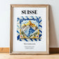 Suisse, Switzerland – Travel Print, in wooden frame leaning on the floor
