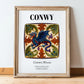 Conwy, Wales – Travel Poster, in wooden frame leaning on the floor